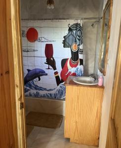 a bathroom with a shower with a sink and a tub at Seacret Studios - Cozy Jamaican Retreat apts in Negril +18 photos