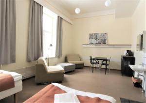 Postel nebo postele na pokoji v ubytování Forenom Hostel Röykkä