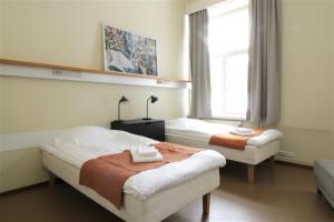 Postel nebo postele na pokoji v ubytování Forenom Hostel Röykkä