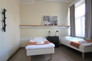 Postel nebo postele na pokoji v ubytování Forenom Hostel Röykkä