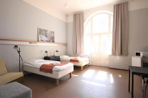Postel nebo postele na pokoji v ubytování Forenom Hostel Röykkä