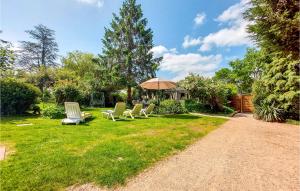 A garden outside Beautiful Home In Thierville With Outdoor Swimming Pool