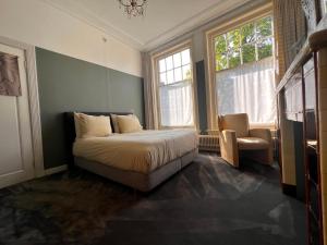 Ένα ή περισσότερα κρεβάτια σε δωμάτιο στο Juliana boutique guestrooms +5 φωτογραφίες