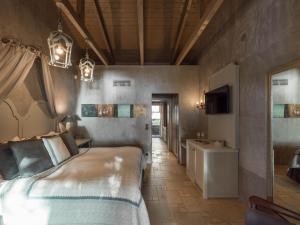 a bedroom with a bed and a sink in it at Six Keys in Afissos