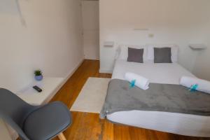 Posteľ alebo postele v izbe v ubytovaní Hostal San Pelayo