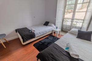 Posteľ alebo postele v izbe v ubytovaní Hostal San Pelayo