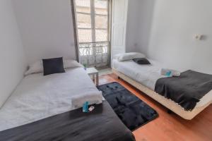 Posteľ alebo postele v izbe v ubytovaní Hostal San Pelayo