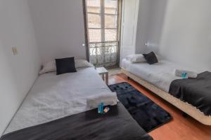 Posteľ alebo postele v izbe v ubytovaní Hostal San Pelayo