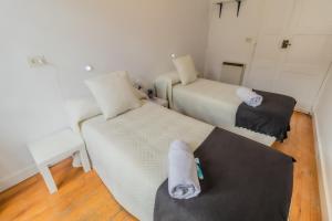 Posteľ alebo postele v izbe v ubytovaní Hostal San Pelayo