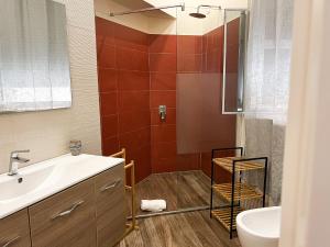 a bathroom with a sink and a shower at Al 115 Rooms in Cagliari +41 photos