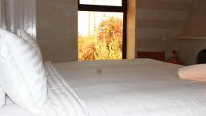 Postel nebo postele na pokoji v ubytování VILLA ZAHR'ALI