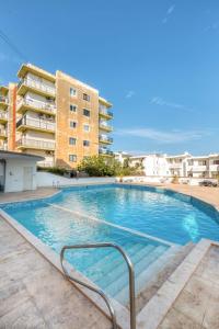 a swimming pool in front of a building at Pool Apartment-Hosted by Sweetstay in Is-Swieqi
