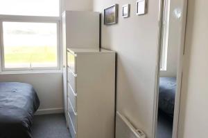 Postel nebo postele na pokoji v ubytování Sandy Wickets