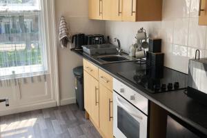 Kuchyň nebo kuchyňský kout v ubytování Sandy Wickets