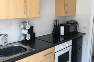 Kuchyň nebo kuchyňský kout v ubytování Sandy Wickets