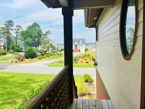 a view from the porch of a house at Fairway to Heaven home in Supply