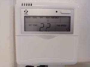 a white oven with a clock on top of it at Apartment 3 kamers Nador Jadid Hay Al Matar appart 006 in Nador