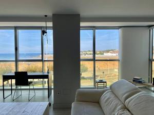 Posedenie v ubytovaní Espectacular apartamento en Playa de San Lorenzo