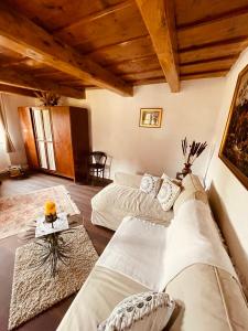 a large room with two beds and a table at A Házikó - Cottage in Vonyarcvashegy