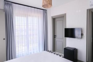 Televisyen dan/atau pusat hiburan di Arcadia Butik Otel