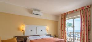 Postel nebo postele na pokoji v ubytování Hotel Orizzonte