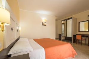 Postel nebo postele na pokoji v ubytování Hotel Orizzonte