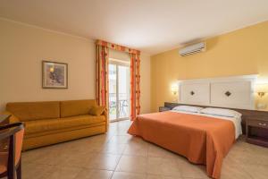 Postel nebo postele na pokoji v ubytování Hotel Orizzonte