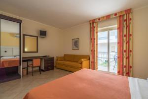 Postel nebo postele na pokoji v ubytování Hotel Orizzonte