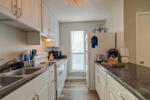 a kitchen with a sink and a refrigerator at Sea Horse 112 by Vacation Homes Collection in Gulf Shores