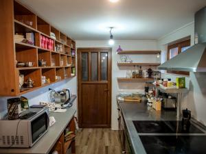 a kitchen with a counter top and a microwave at Hanu lu’ Vasile in Breb