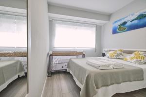 Posteľ alebo postele v izbe v ubytovaní La Casa de Julia Apartamento nuevo y céntrico