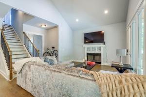 a living room with a couch and a fireplace at Quaint Newnan Vacation Rental Near State Park! in Newnan