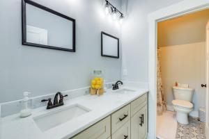 a bathroom with a sink and a toilet at Quaint Newnan Vacation Rental Near State Park! in Newnan +19 photos