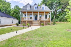 a large house with a porch and a large yard at Quaint Newnan Vacation Rental Near State Park! in Newnan