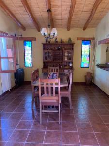 a dining room with a table and chairs at La casa de Mamina in Tilcara