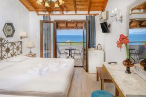 Postel nebo postele na pokoji v ubytování Leandros Hotel + 37 fotografií