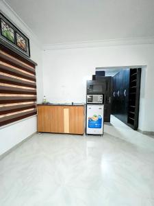 an empty room with a refrigerator in the middle at Montreal Suite by Jaynice Homes in Lekki