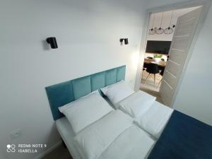 Ліжко або ліжка в номері Apartamenty La Venda