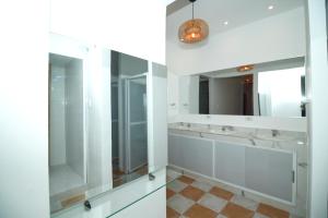 a bathroom with three sinks and a mirror at Hostal Casa Torres Centro Historico - Adults Only in Cartagena de Indias