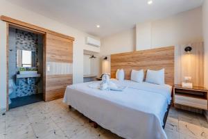 Postel nebo postele na pokoji v ubytování Hotel Central Merida by Kavia