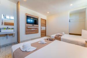 Postel nebo postele na pokoji v ubytování Hotel Central Merida by Kavia + 34 fotografií