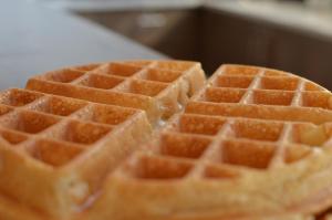 a stack of waffles sitting on top of a table at Sheraton Albuquerque Uptown by Marriott in Albuquerque