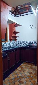 Kuchyň nebo kuchyňský kout v ubytování Verdant Vagamon Cottage + 24 fotografií