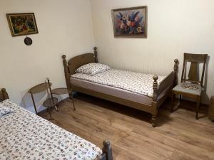 Lova arba lovos apgyvendinimo įstaigoje Arbatinės apartamentai - Močiutės namelis