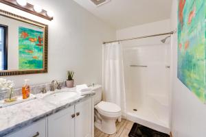 a bathroom with a sink and a toilet and a shower at Pet-Friendly House about 2 Mi to Lake Havasu Beach! in Lake Havasu City +17 photos