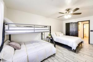 a bedroom with two beds and a ceiling fan at Pet-Friendly House about 2 Mi to Lake Havasu Beach! in Lake Havasu City