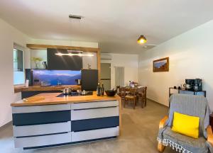 a kitchen with a sink and a counter top at Lago Lodge Claudia in Domaso