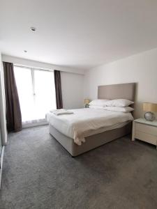 Postel nebo postele na pokoji v ubytování Apartment in City Centre Glasgow