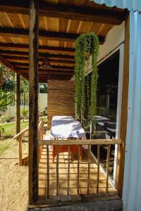 a patio with a table with a towel on it at Kali Village in Acapulco