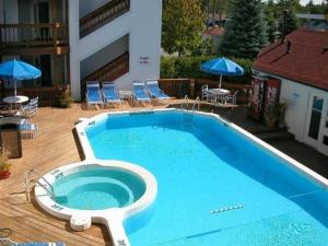 a large blue swimming pool with a toilet in it at Beachside 329 Waterfront Condo in Traverse City